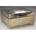 A silver table cigarette box, with presentation inscription , w.8.5cm