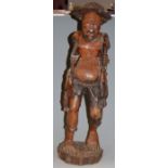 An Aboriginal(?) carved hardwood figure of a fisherman, h.66cm