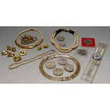 A collection of miscellaneous items to include a Swatch team wrist watch, commemorative crowns,