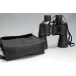 A pair of modern 6x10 binoculars in canvas pouch