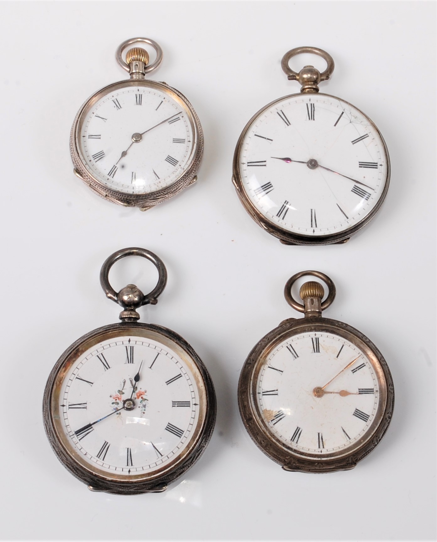 Three Swiss silver lady's pocket watches together with another marked 'Fine Silver', (4)