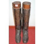 A pair of gentleman's black leather knee length riding boots