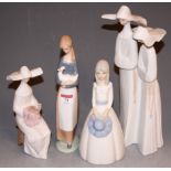 A large Lladro figure group of two nuns, printed mark verso and numbered 4611, h.31cm; together with