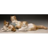 A Lladro porcelain kitten and two Nao porcelain cats (3)