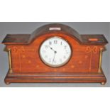 An Edwardian mahogany and satinwood inlaid mantel clock, having enamelled dial with Arabic numerals,