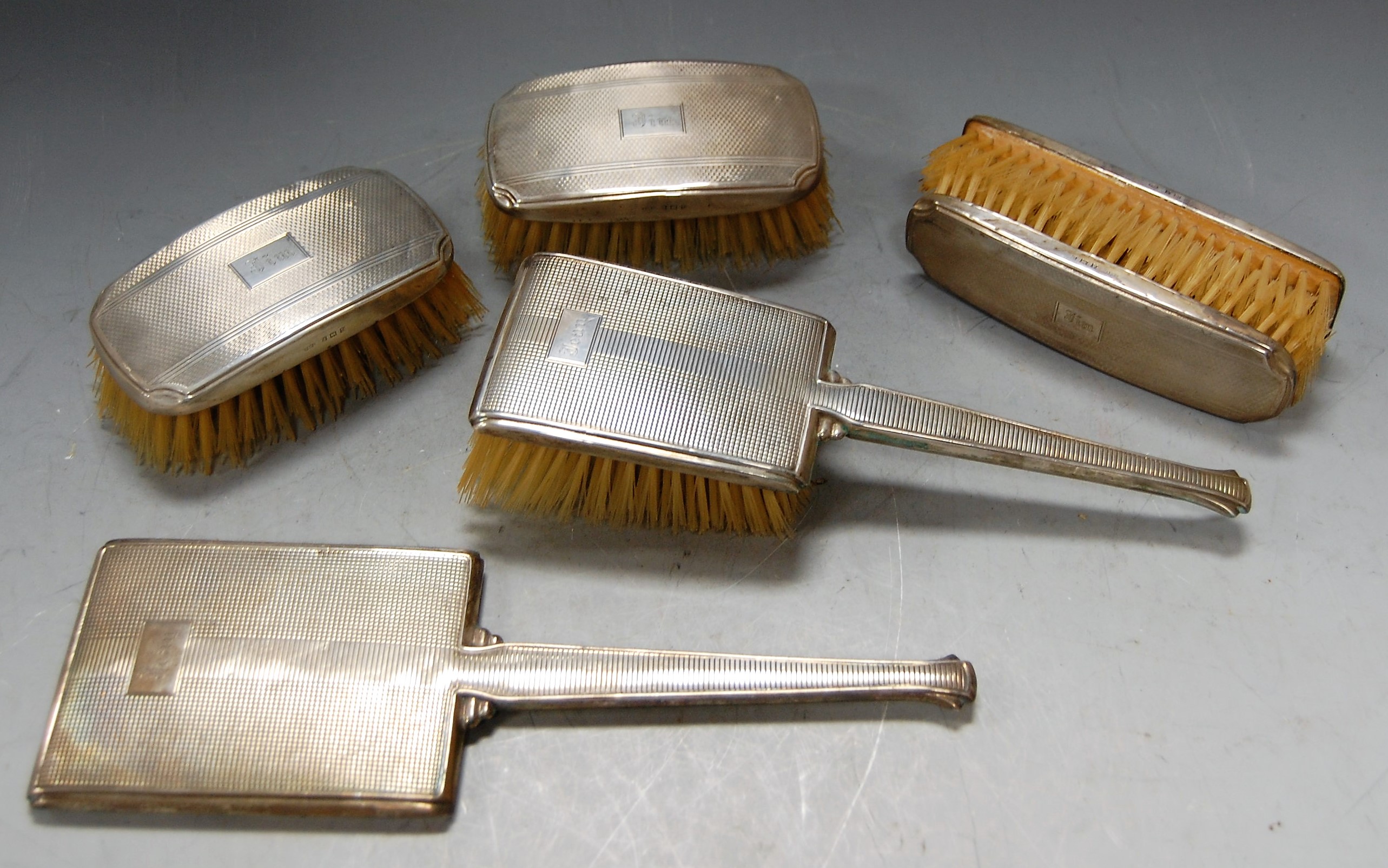 Assorted silver backed dressing table wares, to include clothes brushes, hairbrush, hand mirror etc