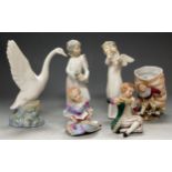 Three various Nao porcelain figures; together with Continental porcelain figures and a spill-