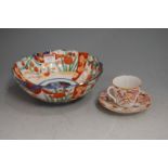 A 19th century porcelain teacup and saucer, decorated in the Japanese taste; together with a