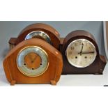 An Art Deco oak cased mantel clock, having silvered chapter ring with Arabic numerals and chiming