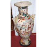 An extremely large Japanese floor vase, having flared rim, reticulated neck, and mythical bat-wing
