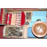 A box of miscellaneous metalwares to include various loose silver plated flat wares, copper jar
