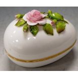 A modern Coalport porcelain floral encrusted egg, w.13cm