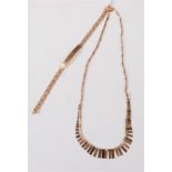 A 9ct tri-coloured gold fringe necklace and 9ct bracelet, (13.3g)