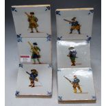 A set of seven delft tiles, each decorated with single figure, 10 x 10cm
