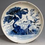 A large 19th century Japanese charger with typical blue & white floral decoration, dia. 40cm