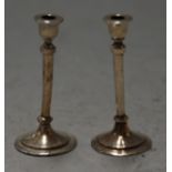 A pair of late Victorian silver miniature candlesticks by William Comyns, London 1891, height 4cm
