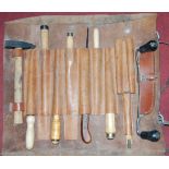 A leather carpenter's tool bag and contents