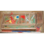 A box containing a quantity of mid-20th century Meccano, to include red and green components