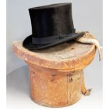 An early 20th century brushed velvet top hat, bearing label for G. Mordacque, in brown leather hat
