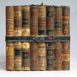 A Huntley & Palmers novelty biscuit tin in the form of eight bound books with a strap fastening,
