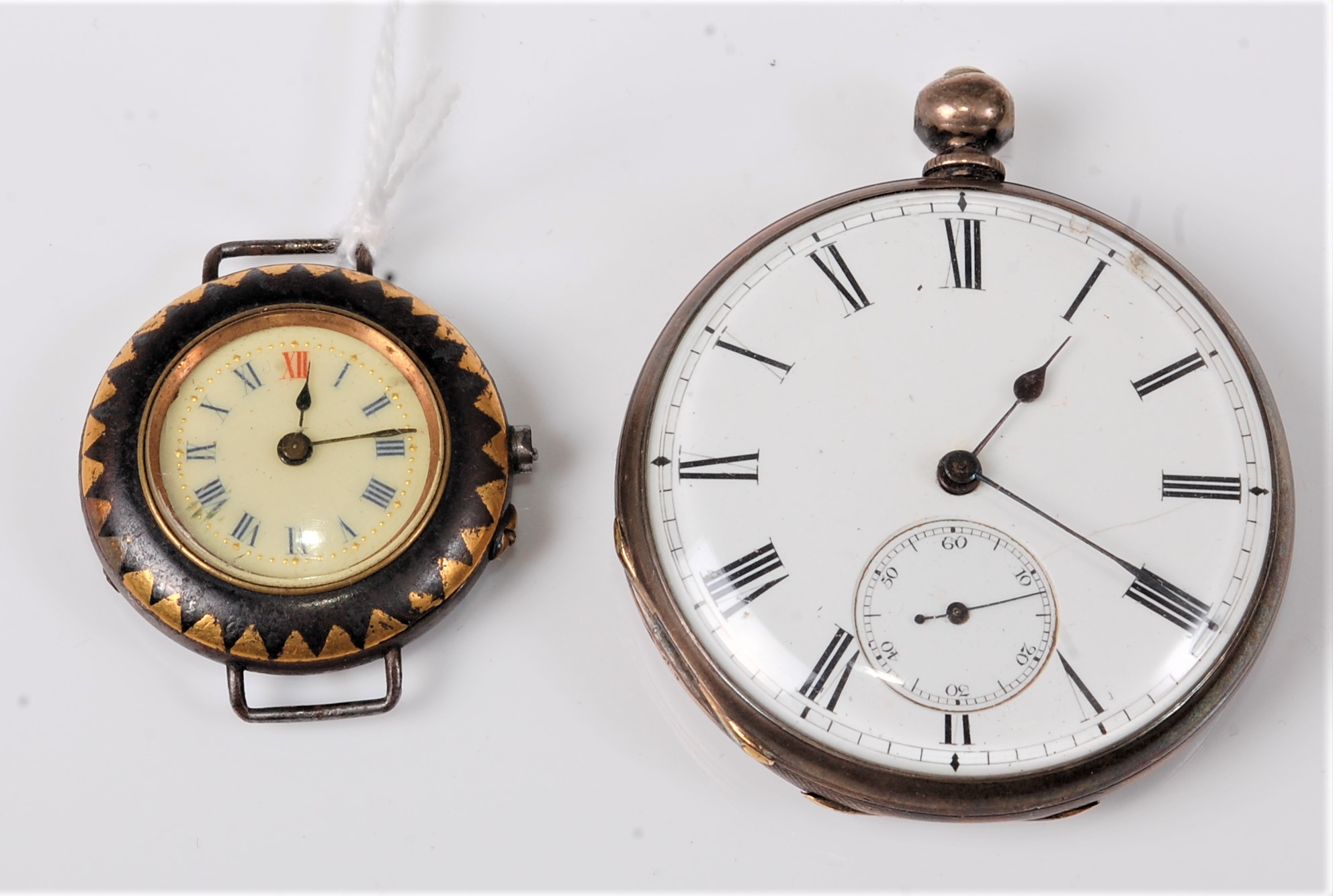 An open faced pocket watch, white enamel dial with black Roman numerals and hands, subsidary