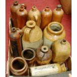 A large quantity of stoneware bygone flagons and foot-warmers