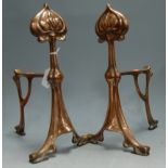 A pair of Art Nouveau copper andirons