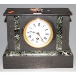 A circa 1900 black slate and marble mantel clock having an enamelled dial with Roman numerals and 30