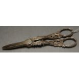 A pair of early 20th century grape scissors having white metal floral entwined handles and steel