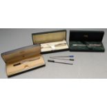 Two Cross silver cased ballpoint pens each boxed with outer sleeve together with one other Cross