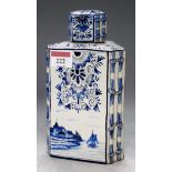 A Dutch delft tea canister and cover, of triangular form (cover a/f)