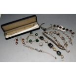 A ladies three string pearl choker with silver clasp, together with a white metal bangle and