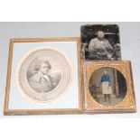 A Victorian overpainted daguerreotype of a gentleman in standing pose together with one other