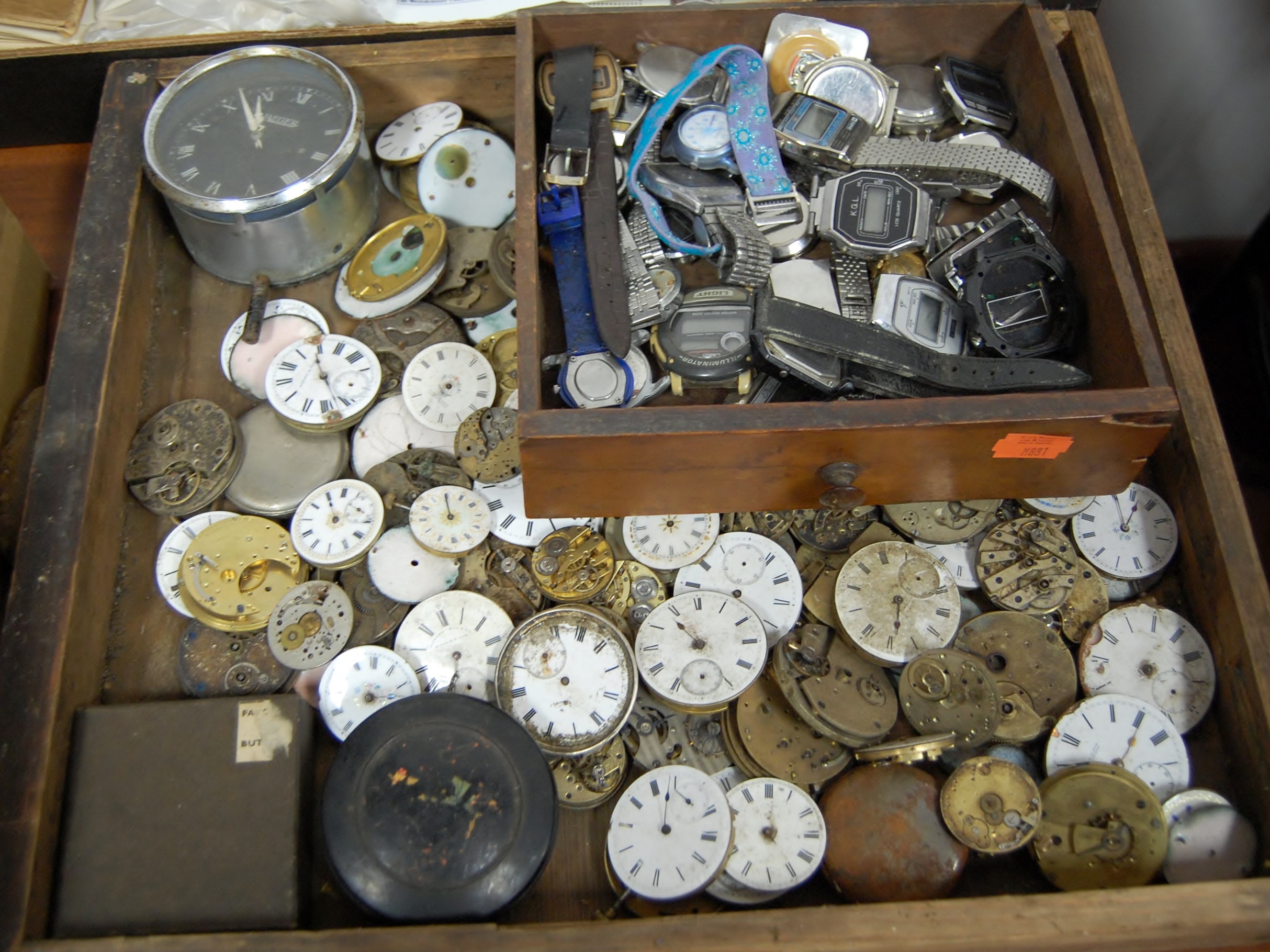 A large collection of assorted pocket watch parts, wristwatches etc