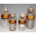 Four early 20th century apothecary jars and stoppers, each with annotation, largest h.25cm