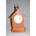 A late 19th century German pine cased steeple clock, having painted dial with Roman numerals, h.