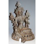 A late 19th century Tibetan spelter figure of Tara, in typical seated pose (in two parts), h.45cm