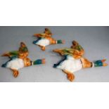 A set of three Beswick flying duck wall ornaments, No.s 596, 2, 3 and 4