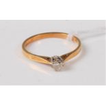 An 18ct gold diamond solitaire ring, the round brilliant cut diamond estimated approx. 0.16cts, claw