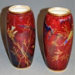 A pair of Tuscan China red lustre vases decorated in gilt with birds, impressed mark and Made in