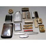 A collection of miscellaneous items to include various pocket cigarette lighters, pocket knives,