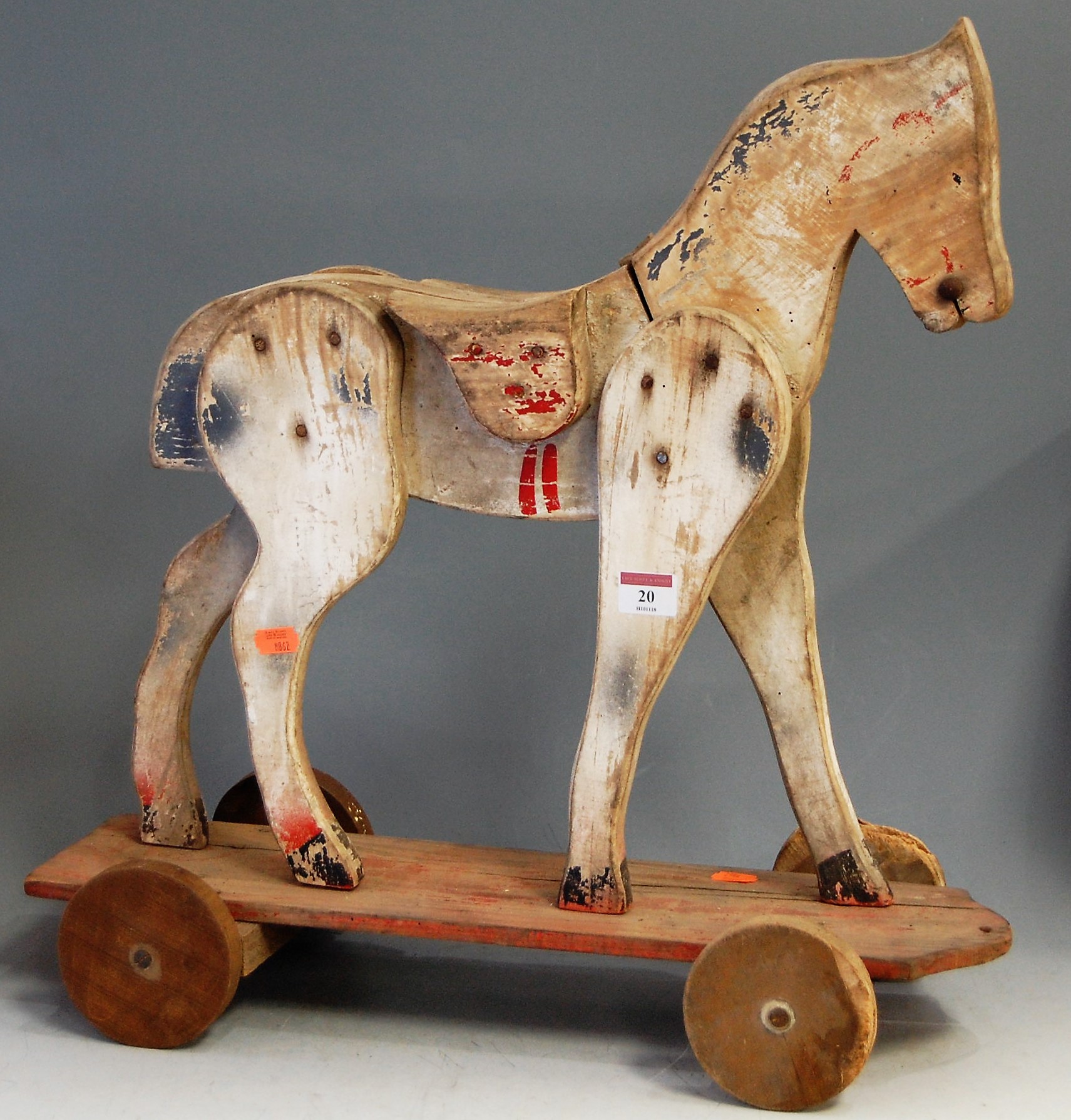 A mid-20th century childs' painted push-along horse, h.53cm