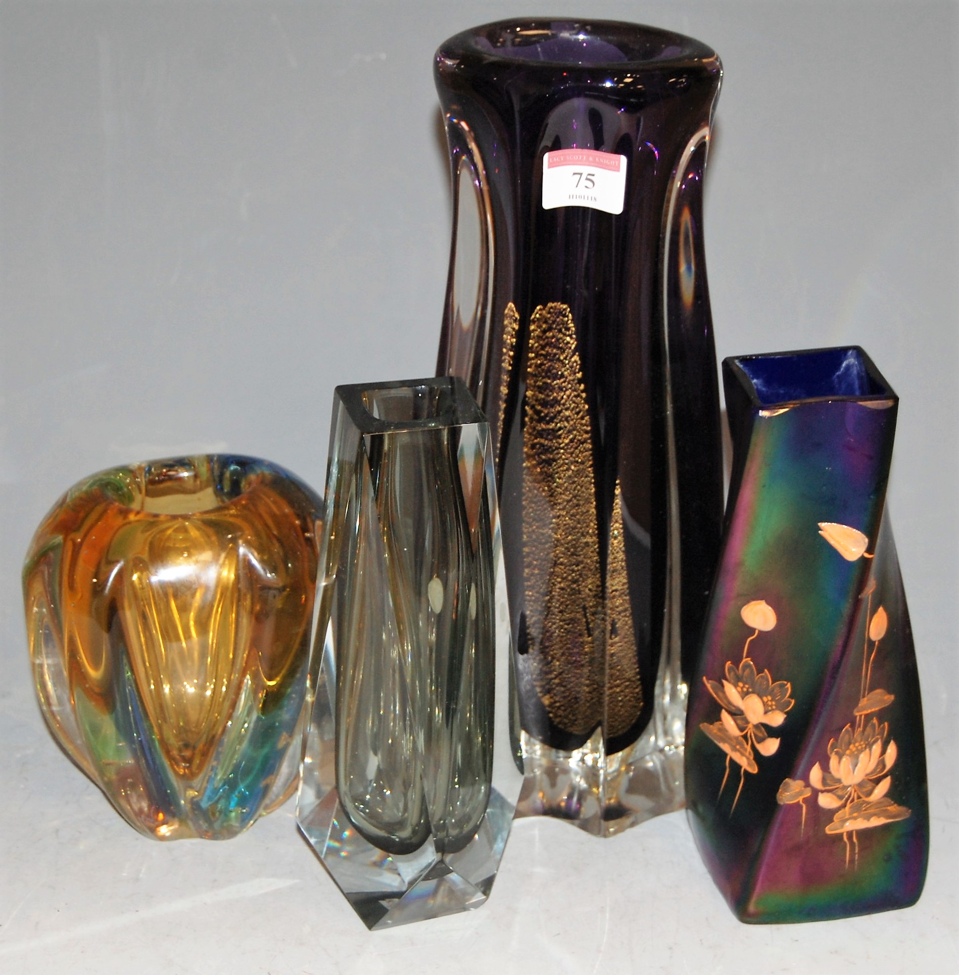 A mid 20th century iridescent glass vase of square twisted form having applied lilypad decoration,