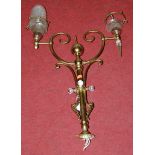 An early 20th century lacquered brass twin sconce ceiling light fitting (lacking one shade)