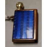 A blue enamel vesta/striker, of book shape with brass wick/taper, stamped '68 EFBEE', 3.5cm high