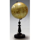 A circa 1910 Bavarian celestial table top globe dia. 10cm on turned ebonised stand with integral