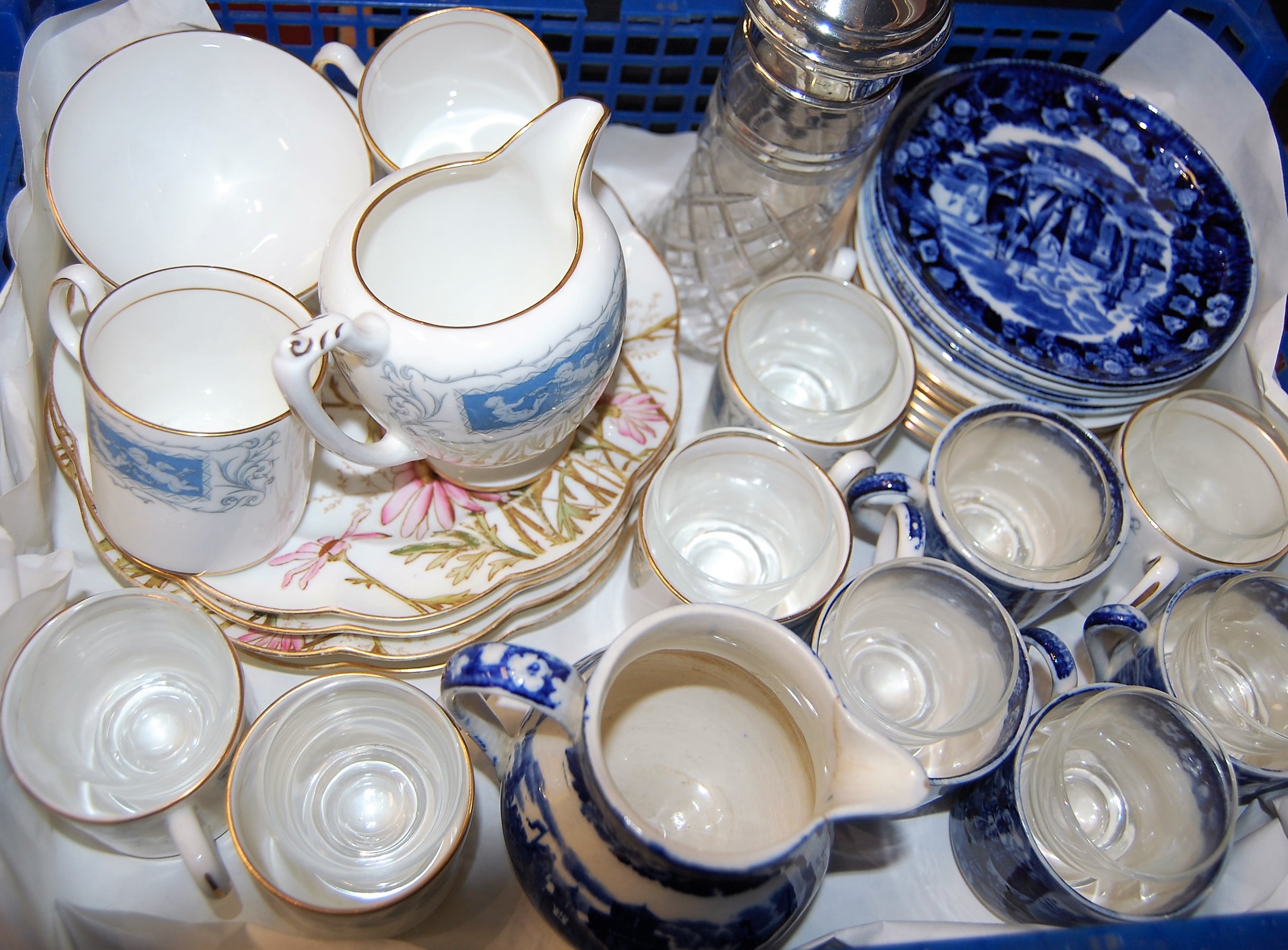 A 20th century sugar sifter having a cut glass body and silver mount, together with blue & white