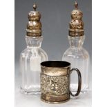 A pair of circa 1830 faceted glass and silver topped sugar casters; together with an Edwardian