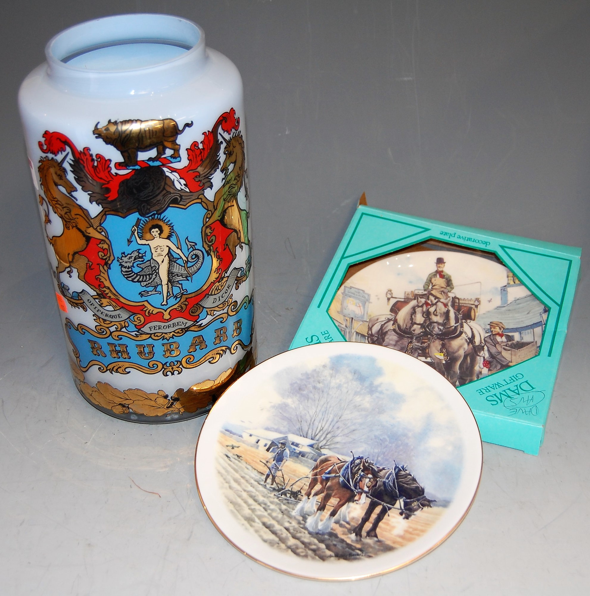 A large early 20th century blue glass rhubarb vase, having painted heraldic shield and rhubarb