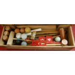 A mid-20th century pine cased croquet set